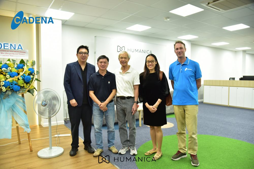 Cadena and Humanica Group team members posing together on the new floor